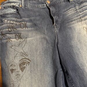 Torrid Blue Straight Leg Jeans with Distressing and Decorative Elements